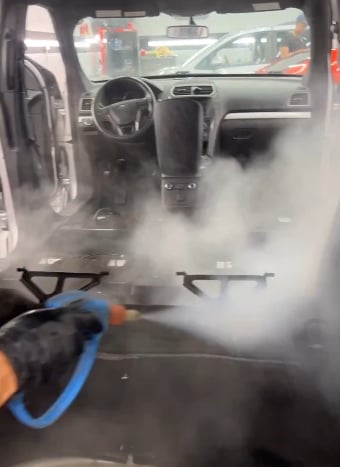 Steam cleaning dashboard and steering wheel - Orlando Auto Detailing